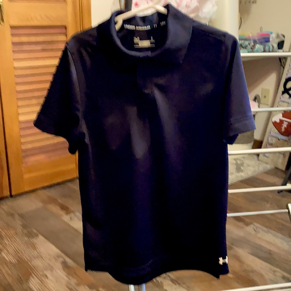 Size 7 under armour polo shirt. Like new barely worn.